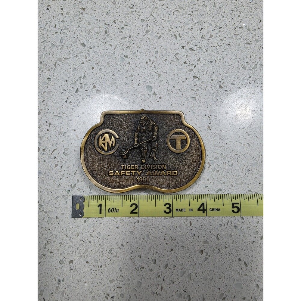 Vintage brass-toned belt buckle  text "TIGER DIVISION SAFETY AWARD 1981"
